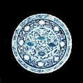  A rare moulded blue and white barbed-rim charger. Yuan Dynasty