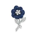 A "mystery-set" sapphire and diamond flower brooch by Van Cleef & Arpels