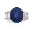 Bague en or gris ornée d'un saphir ovale pesant 13,95 cts 