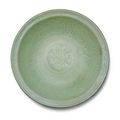 A carved and molded celadon-glazed 'Longquan' dish, Ming dynasty, 15th-16th century