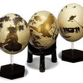Three ostrich eggs & A Japanese ivory and wood okimono signed Mitsuyuk, Meiji period 