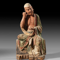 A wood figure of a seated Luohan, Ming dynasty (1368-1644), 16th century