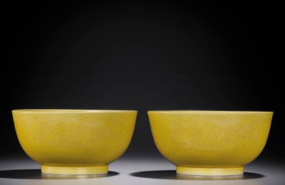 A pair of yellow-enamelled incised 'dragon' bowls, Jiaqing six-character seal marks and of the period (1796-1820)