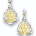 Impressive pair of fancy yellow diamond and diamond pendent.earrings