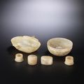 A group of small pale brown and grey jade vessels, Western Han Dynasty (206 BC-AD 9)