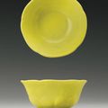 A rare yellow-glazed molded 'mallow-flower' wine cup, Yongzheng mark and period