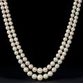 An important two-strand natural pearl and diamond necklace