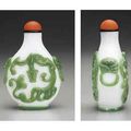 A Rare And Finely Carved Green-Overlay White Glass Snuff Bottle. Attributed To The Imperial Glassworks, Beijing, 1760-1820  