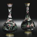 An exceptionally rare pair of Beijing enamel 'peach and bat' vases, Qianlong marks and period