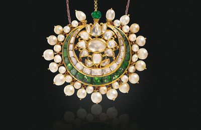 An antique emerald, diamond, pearl and enamel tikka, mid-19th century