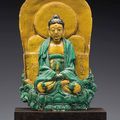 A dated sancai-glazed stoneware figure of Buddha, dated to mid-autumn of the yimao year of Jiajing, corresponding to 1555