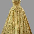 Norman Hartnell, Lime green gown with crinoline skirt heavily embroidered with beads and sequins