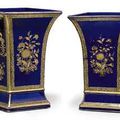 A very large and unusual pair of gilt-decorated blue-ground vases, circa 1790