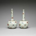 A matched pair of famille verte 'floral roundel' bottle vases, Kangxi period (1662-1722)