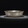 A superb and rare silvered-metal 'Mandarin ducks' bowl, Tang dynasty (618-907)