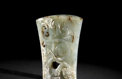  A jade 'dragon' sword cape, Han Dynasty (206 BC-AD 220)