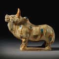 A rare sancai-glazed pottery figure of a spotted bull, Tang dynasty (618-906)
