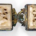 A set of two fine openwork carved jade plaques mounted to coppergilt belt hooks. China, probably Ming dynasty