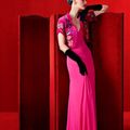 Model Guinevere Van Seenus wears shocking-pink Schiaparelli dress