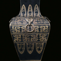 A porcelain vase bronze and gold imitation with relief archaic decoration, China, Qing Dynasty, 19th century
