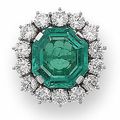 An 10.30 carats octagonal mixed-cut emerald and diamond cluster ring