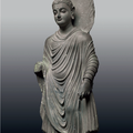 An Important Gray Schist Figure of a Standing Buddha, Gandhara, 2nd-3rd century