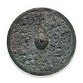 A rare bronze circular  'dragon' mirror. Warring States Period (475-221 BC)
