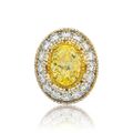 A 5.01 carat fancy yellow diamond and diamond ring