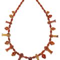 An Egyptian carnelian and agate bead and amuletic necklace, Third Intermediate Period, 21st-22nd dynasty, circa 1069-664 B.C.