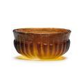 A Roman amber glass ribbed bowl, Late 1st Century B.C. - early 1st Century A.D.