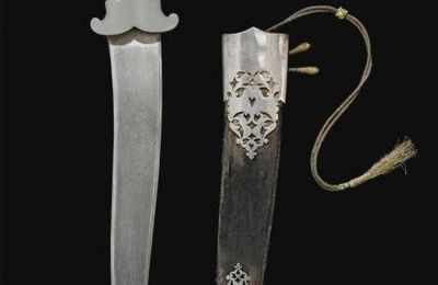 A rare Mughal gem-set jade-hilted dagger (peshkabz), North West India, 17th-18th century & A jade-hilted dagger, India,  18th ct