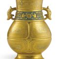 An extremely rare gold and silver-decorated 'bronze-imitation' archaistic vase, zun, Seal mark and period of Qianlong