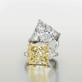 A 7.34 carats brilliant-cut diamond single stone ring & A 12.31 carats Fancy Yellow diamond single stone ring