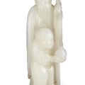 A white jade figure of Shoulao, Qing dynasty, 18th century 