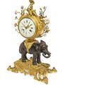 A fine and rare Louis XV porcelain, ormolu and patinated bronze elephant clock, mid 18th century