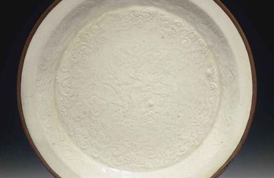 A molded Dingyao dish, Jin dynasty (1115-1234)