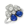 A Cabochon Sapphire and Diamond Flower Ring, circa 1935