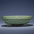 A large carved and moulded Longquan celadon tripod censer, Ming dynasty, 15th century