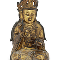 A gilt-bronze seated figure of Guanyin, Late Ming dynasty (1368-1644)