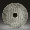 A large pale grey jade disc, bi, Han dynasty, 2nd-1st century BC 