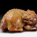 A mottled brown jade carving of a mythical beast, China, Ming dynasty