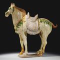 A large sancai-glazed and painted pottery figure of a Ferghana horse, Tang dynasty (618-907)