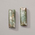 A pair of mottled green jade tubular ornaments, Neolithic period (circa 6500-1700 BC)