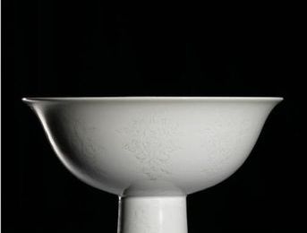 An incised-decorated 'Anhua' stembowl. Mark and period of Yongzheng