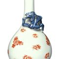 An iron-red and underglaze-blue decorated 'Dragon and Prunus' bottle vase, Qing dynasty, Kangxi period (1662-1722)
