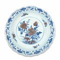 A rare ming-style blue and white and copper-red barbed-rim dish, Qianlong seal mark and of the period (1736-1795)
