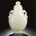 A white jade archaistic 'phoenix' flask and cover. Qing dynasty, late 18th / early 19th century