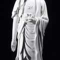A large, standing blanc-de-chine buddha, China, 18th century marked "Dehua" and "Pu zi yu ren" 