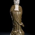A part teadust-glazed porcelain model of standing Damo, late Qing-Republic period