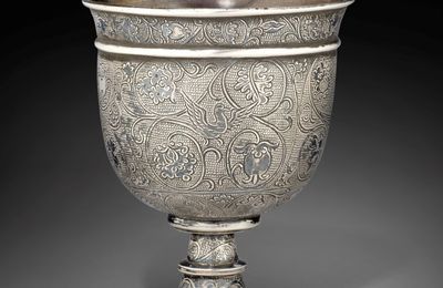 A finely engraved silver stem cup, Tang dynasty (AD 618-907);